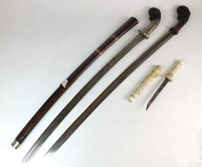Lot 194 - Two Malayan Parang Short Swords and a Japanese bone tanto