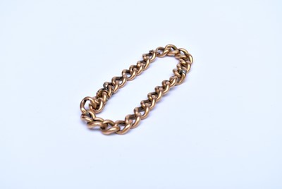 Lot 130 - A yellow metal hollow curb link bracelet