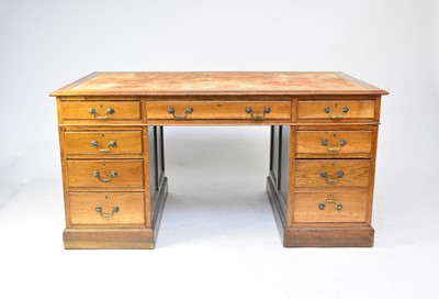 Lot 707 - A 20th century oak pedestal desk