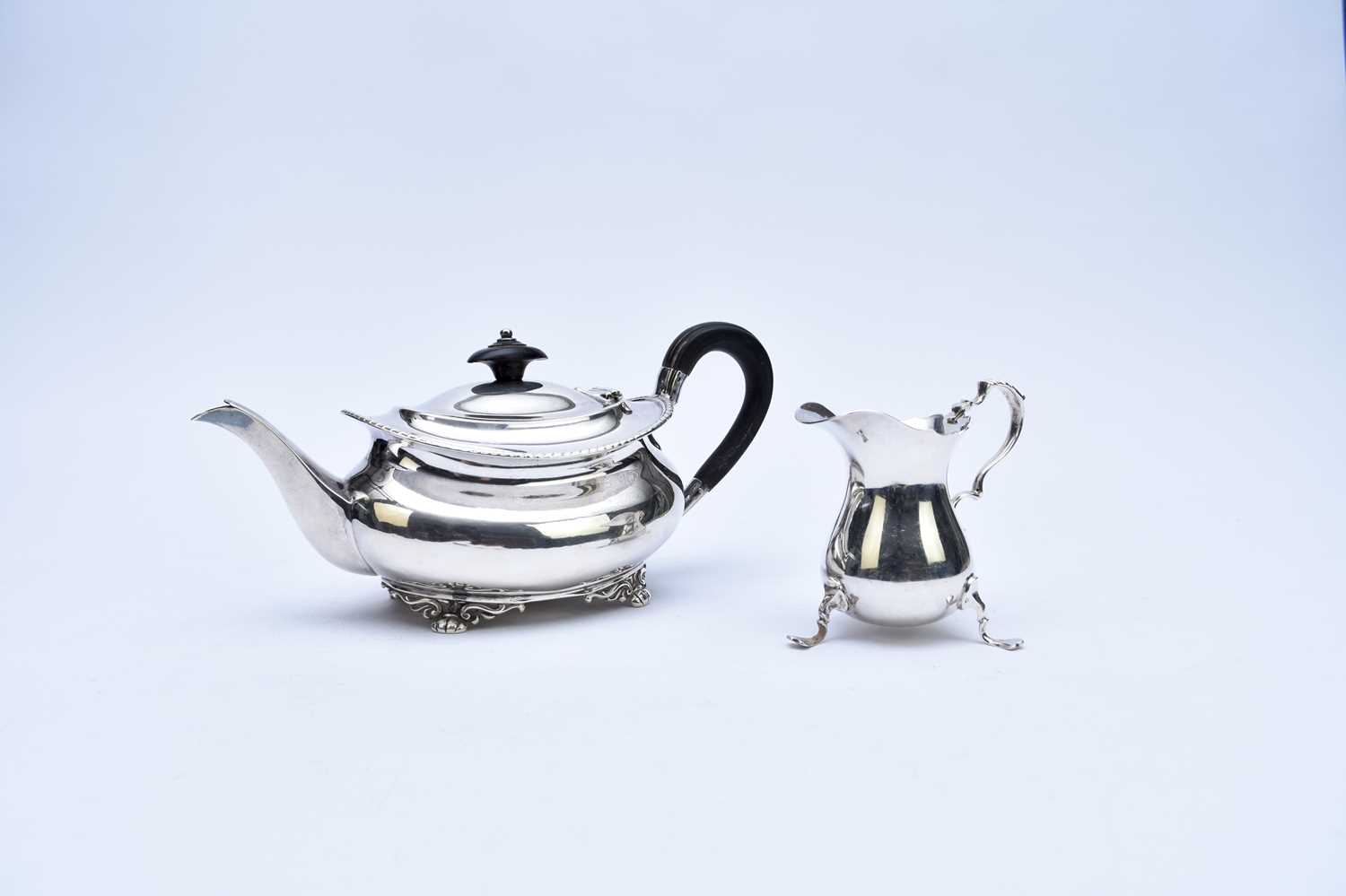 Lot 35 - A silver teapot and cream jug