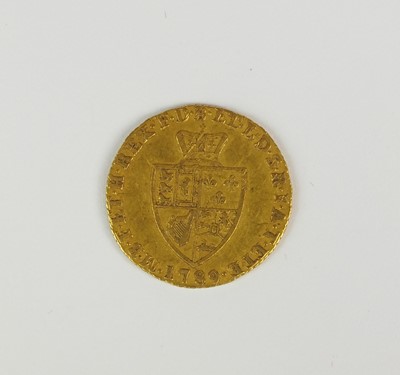 Lot 132 - A George III half spade guinea