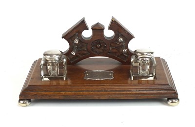 Lot 563 - An Edwardian silver mounted oak desk stand