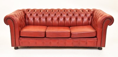 Lot 740 - A red leather Chesterfield sofa, 20th century