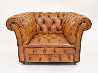 Lot 742 - A tan leather Chesterfield armchair, 20th century
