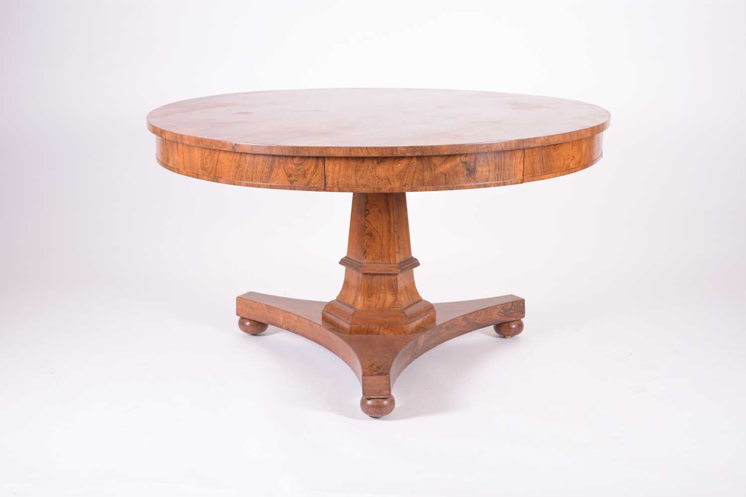 302 - A George IV rosewood revolving drum table by Gillows of Lancaster
