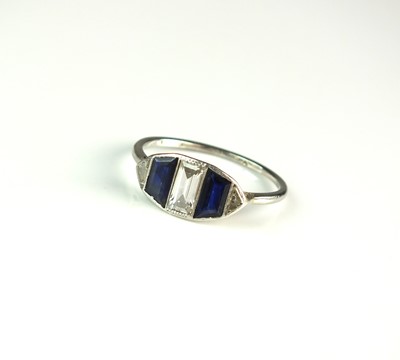 Lot 48 - An Art Deco five stone sapphire and diamond ring