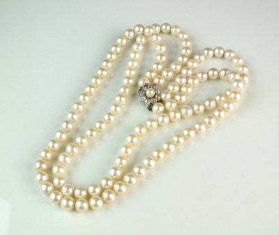 Lot 52 - A two strand uniform cultured pearl necklace with diamond clasp