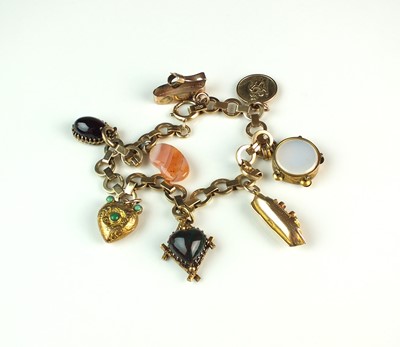 Lot 55 - A 9ct gold circular link bracelet with attached charms