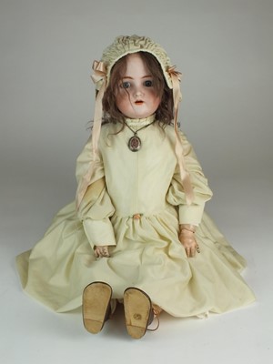 Lot 561 - A Simon & Halbig doll with additional dress