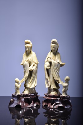 Lot 563 - A near pair of Chinese carved soapstone figures of Guanyin