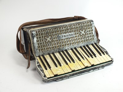 Lot 585 - Two cased piano accordions: Hohner and a Selmer