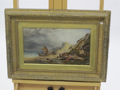 Lot 348 - English School circa 1870. A coastal scene with Fishermen by boats