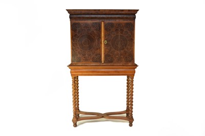 Lot 295 - A William and Mary oyster veneered cabinet on a later stand