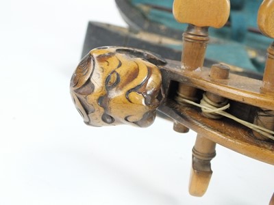 Lot 583 - An early 20th century griffin-headed violin