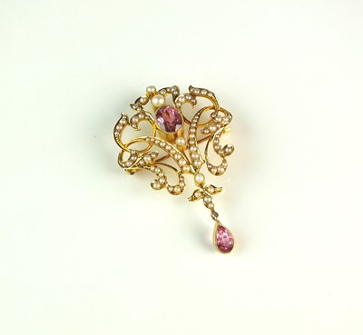 Lot 62 - An early 20th century pink tourmaline and seed pearl pendant/brooch