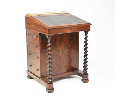 Lot 558 - A Victorian rosewood veneered Davenport