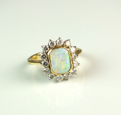 Lot 81 - An 18ct gold opal and diamond cluster ring