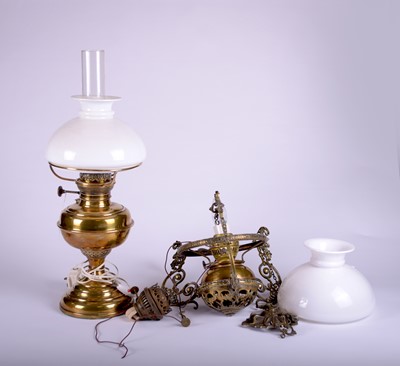 Lot 623 - A brass hanging oil lamp and a brass oil table lamp