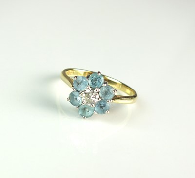 Lot 97 - An 18ct gold diamond and aquamarine floral cluster ring