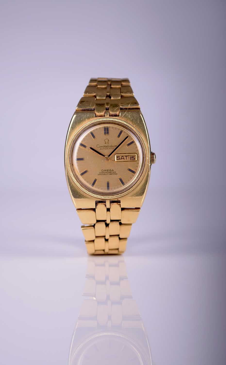 125 - Omega: A gentleman's 18ct gold Constellation bracelet wristwatch