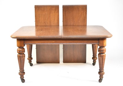 Lot 634 - A Victorian oak telescopic extending dining table