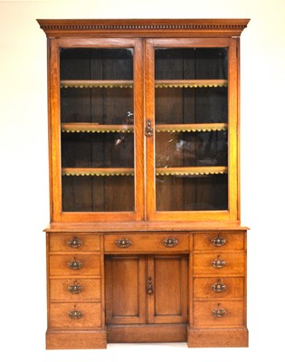 Lot 635 - A Victorian oak bookcase-cum-desk