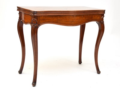 Lot 571 - A 19th century French, figured walnut card table