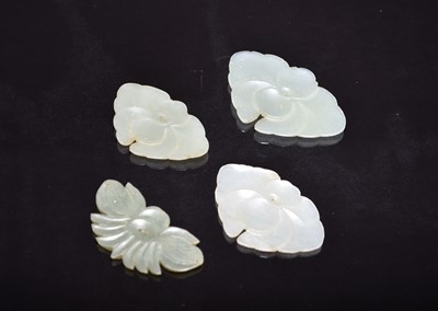 Lot 564 - Four Chinese pale green jade pendants