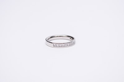 Lot 121 - A platinum diamond half eternity ring