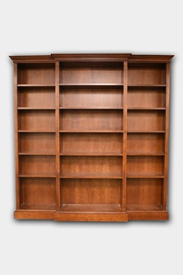 Lot 681 - A reproduction mahogany breakfront open bookcase.