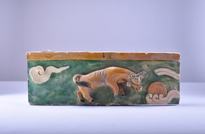 Lot 4 - A Chinese sancai model of a chair and a relief moulded tile, Ming Dynasty