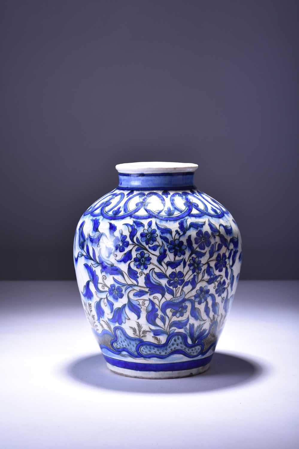 Lot 131 - A Kerman/Kirman style blue and white fritware vase, 20th century