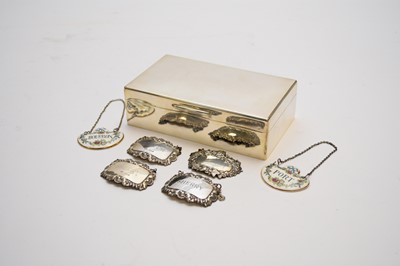 Lot 92 - A silver cigarette box and various wine labels