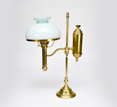 Lot 625 - A reproduction brass adjustable desk lamp