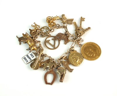Lot 113 - A yellow metal bracelet with attached yellow metal and 9ct gold charms