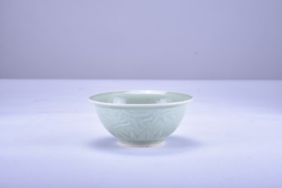 Lot 15 - A small Chinese celadon glazed bowl, 20th century