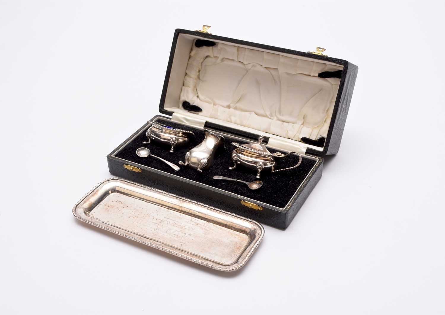 Lot 61 - A cased silver cruet set