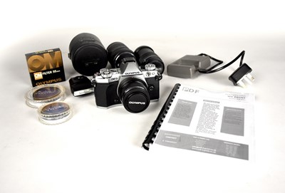 Lot 602 - An Olympus PM-D Camera, lenses and accessories