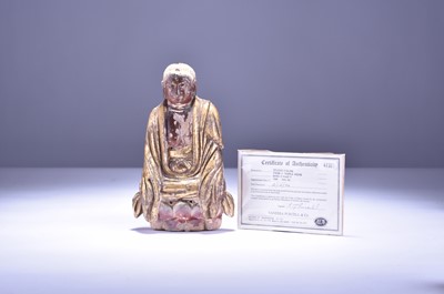 Lot 5 - A Chinese stoneware altar figure of Buddha, Ming Dynasty