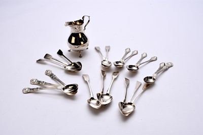Lot 67 - A collection of silver teaspoons and a cream jug