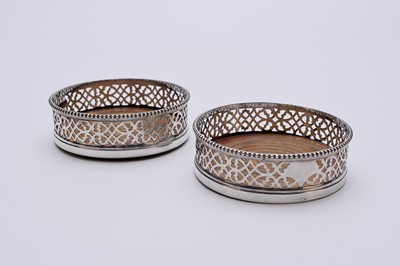 Lot 69 - A pair of silver plated wine coasters
