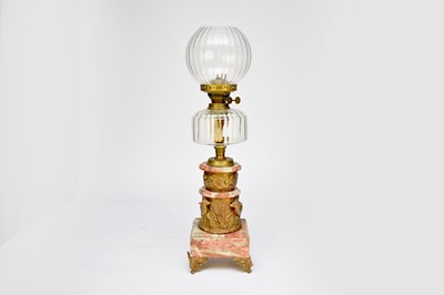 Lot 624 - A gilt-metal and pink veined marble oil lamp