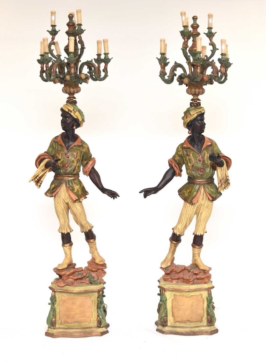 Lot 322 - A pair of reproduction painted wood blackamoor standing lamps
