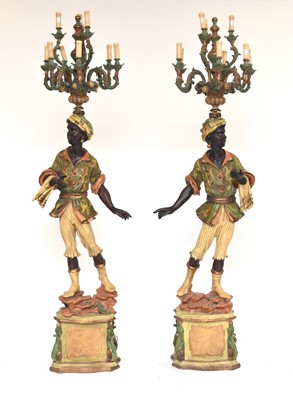 Lot 322 - A pair of reproduction painted wood blackamoor standing lamps