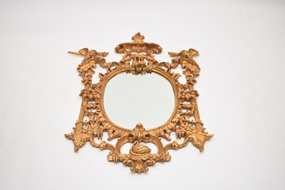 Lot 601 - A reproduction rococo style giltwood wall mirror