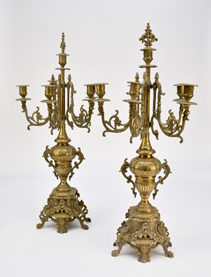 Lot 526 - A pair of brass rococo revival five-branch candelabra