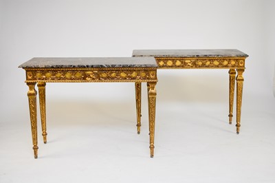 Lot 347 - A pair of Louis XVI style marble-topped console tables