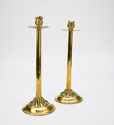 Lot 527 - A pair of early 20th century brass candlesticks