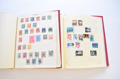 Lot 141 - Collection of stamps in 2 red loose-leaf albums containing