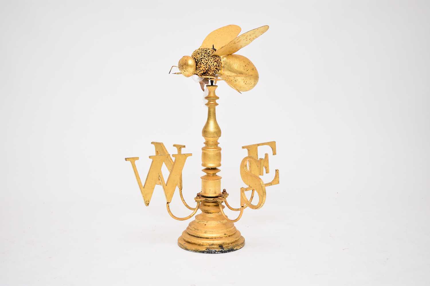 Lot 774 - A novelty, contemporary gold coloured weather vane, with a bee finial, 85cm high